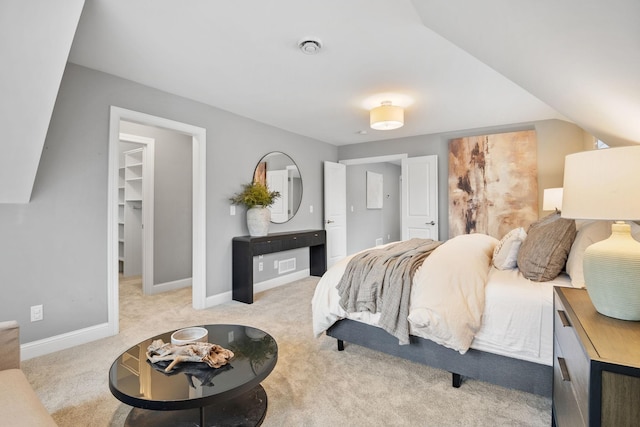 5220 Abbott Ave S, Minneapolis, MN 55410 - bedroom featuring light carpet, a walk in closet, baseboards, and a closet