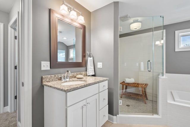 5220 Abbott Ave S, Minneapolis, MN 55410 - full bath featuring a shower stall, a bath, baseboards, and vanity