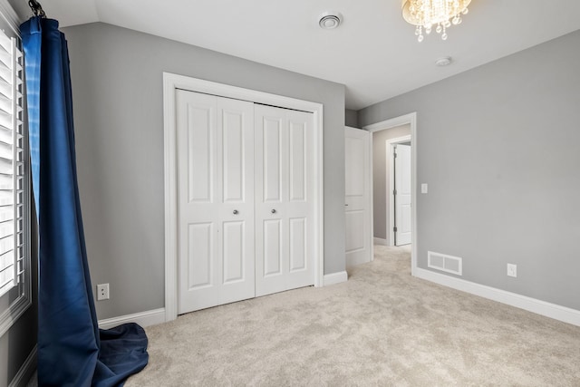 5220 Abbott Ave S, Minneapolis, MN 55410 - unfurnished bedroom featuring carpet floors, a closet, baseboards, and a chandelier