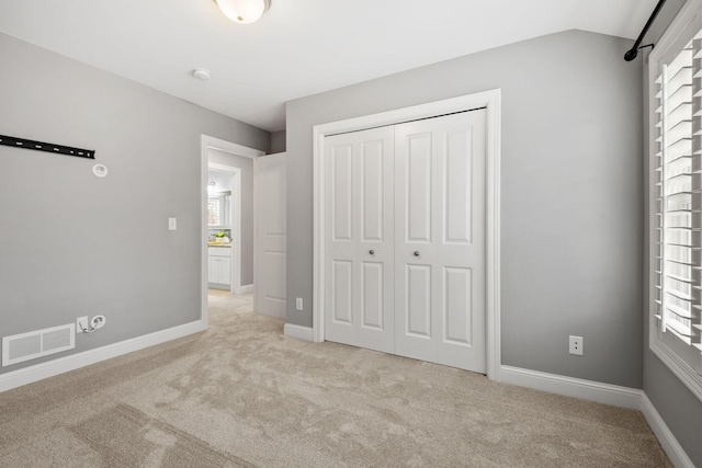 5220 Abbott Ave S, Minneapolis, MN 55410 - unfurnished bedroom featuring light colored carpet, a closet, and baseboards