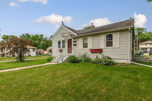 4559 Washington St NE, Columbia Heights, MN 55421 - view of front of house featuring a front lawn and a chimney