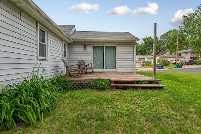 4559 Washington St NE, Columbia Heights, MN 55421 - back of property featuring a wooden deck, a lawn, and a shingled roof
