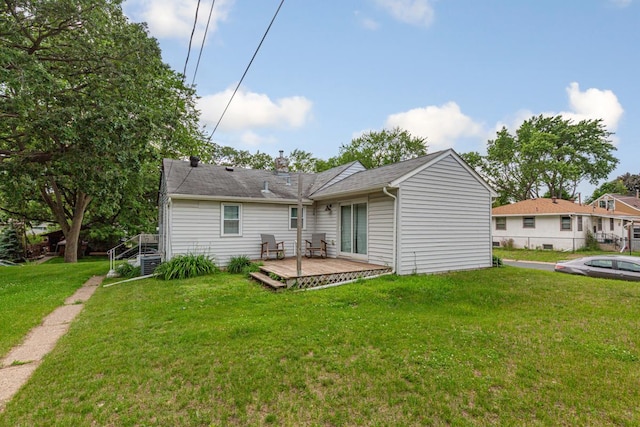 4559 Washington St NE, Columbia Heights, MN 55421 - back of house featuring a wooden deck and a chimney
