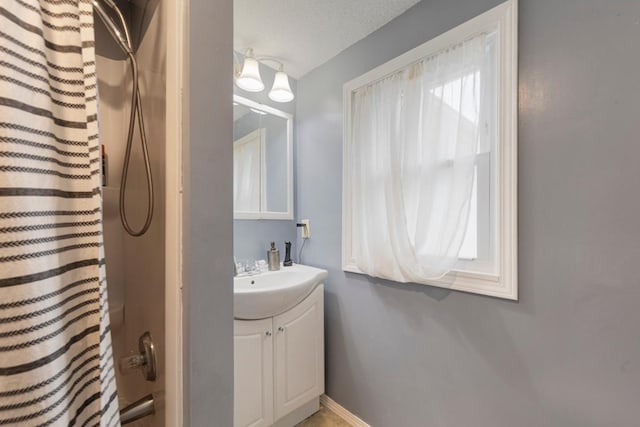 4559 Washington St NE, Columbia Heights, MN 55421 - bathroom with vanity and baseboards
