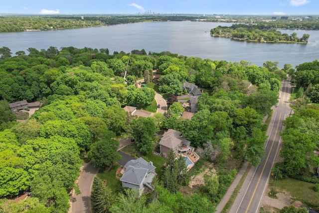 12005 27th Ave N, Plymouth, MN 55441 - aerial view of property and surrounding area featuring a large body of water and a forest