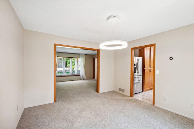 12005 27th Ave N, Plymouth, MN 55441 - empty room with light carpet and baseboards