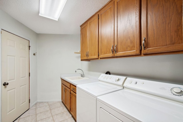 12005 27th Ave N, Plymouth, MN 55441 - laundry area featuring cabinet space, washer and dryer, a textured ceiling, and baseboards