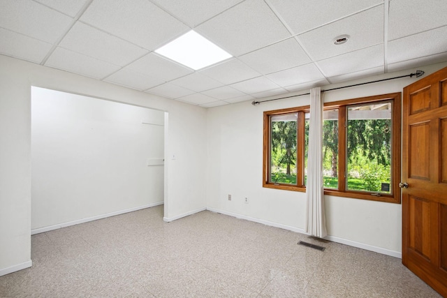 12005 27th Ave N, Plymouth, MN 55441 - unfurnished room with a paneled ceiling, baseboards, and light colored carpet