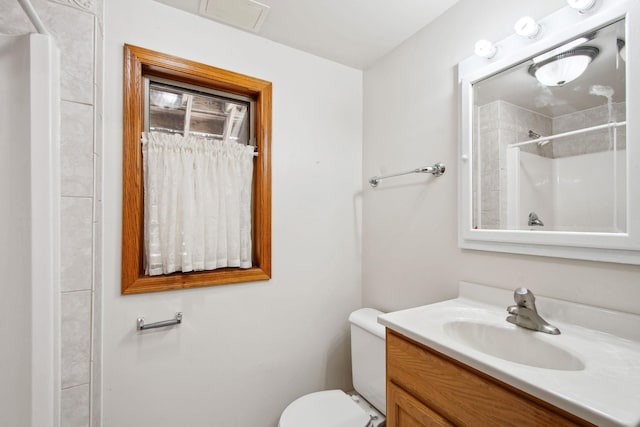 12005 27th Ave N, Plymouth, MN 55441 - bathroom with a shower, vanity, and toilet