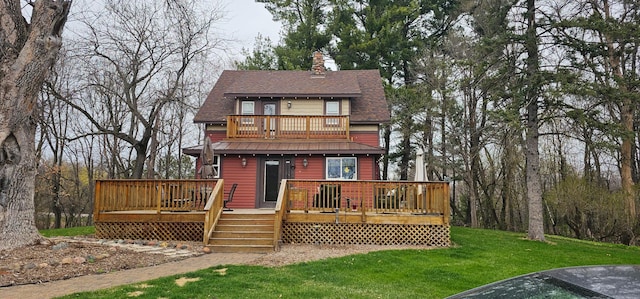 15947 Scandia Trl N, Scandia, MN 55073 - back of house featuring a yard, a chimney, a shingled roof, and a balcony