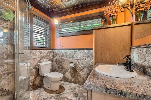 15947 Scandia Trl N, Scandia, MN 55073 - full bath with vanity, toilet, a shower stall, tile walls, and an ornate ceiling