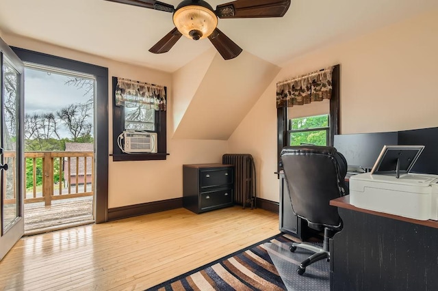 15947 Scandia Trl N, Scandia, MN 55073 - office area featuring radiator, light wood finished floors, ceiling fan, baseboards, and lofted ceiling