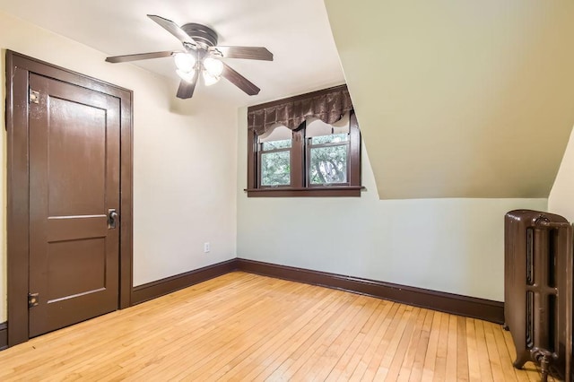 15947 Scandia Trl N, Scandia, MN 55073 - empty room featuring radiator heating unit, hardwood / wood-style floors, ceiling fan, and baseboards
