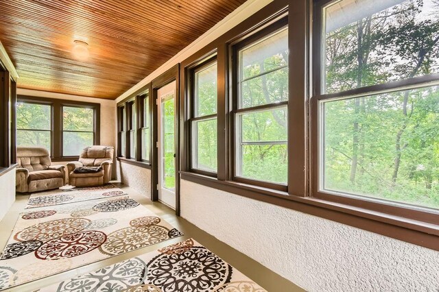 15947 Scandia Trl N, Scandia, MN 55073 - sunroom / solarium featuring healthy amount of natural light, a textured wall, and wooden ceiling