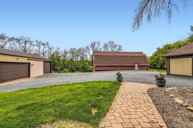 15947 Scandia Trl N, Scandia, MN 55073 - view of grassy yard featuring an outbuilding and a garage
