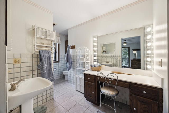 3704 Milton St N, Shoreview, MN 55126 - bathroom with tile walls, tile patterned flooring, a ceiling fan, and a wainscoted wall