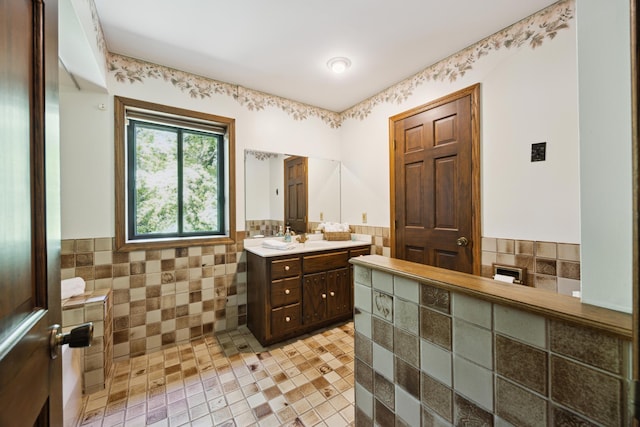 3704 Milton St N, Shoreview, MN 55126 - full bathroom with vanity, tile walls, and a wainscoted wall