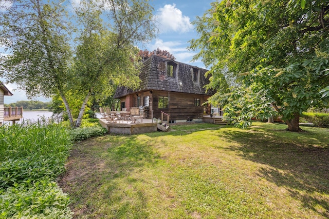 3704 Milton St N, Shoreview, MN 55126 - view of grassy yard with a deck with water view