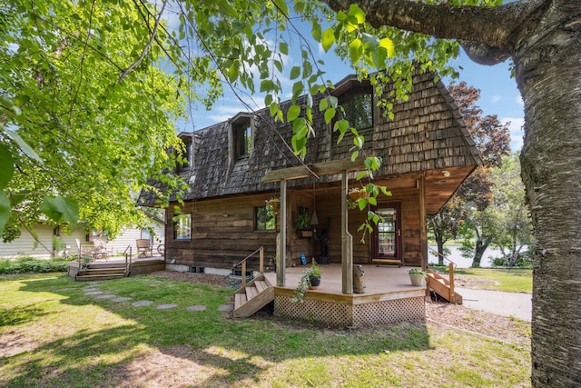 3704 Milton St N, Shoreview, MN 55126 - back of house with a yard, a wooden deck, and mansard roof