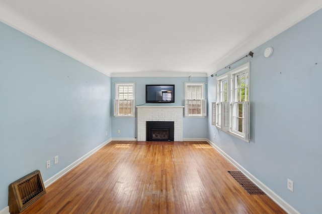 4150 Beard Ave N, Robbinsdale, MN 55422 - unfurnished living room featuring a fireplace and hardwood / wood-style flooring