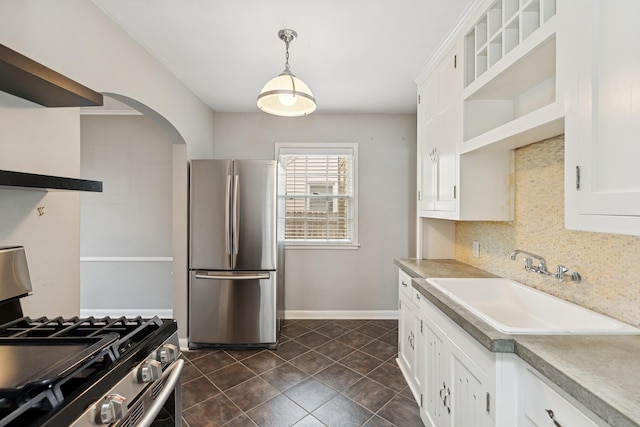 4150 Beard Ave N, Robbinsdale, MN 55422 - kitchen featuring stainless steel appliances, open shelves, arched walkways, decorative backsplash, and white cabinetry