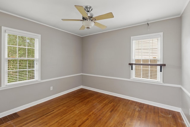 4150 Beard Ave N, Robbinsdale, MN 55422 - unfurnished room featuring wood finished floors, crown molding, and ceiling fan