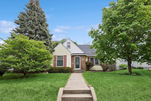 4150 Beard Ave N, Robbinsdale, MN 55422 - view of front facade featuring brick siding and a front yard