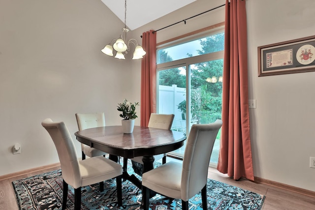 2171 Cleveland Way S, Cambridge, MN 55008 - dining space with a chandelier, light wood-style floors, baseboards, and vaulted ceiling