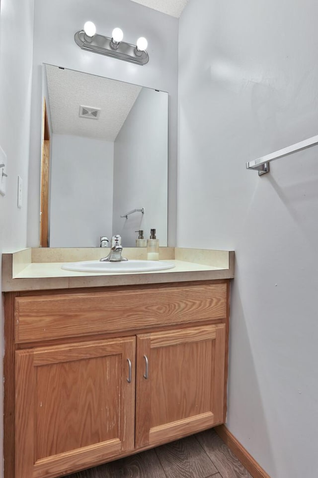 2171 Cleveland Way S, Cambridge, MN 55008 - bathroom featuring vanity and baseboards