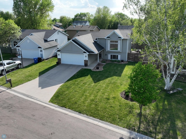 traditional-style home with an attached garage, driveway, roof with shingles, and stucco siding