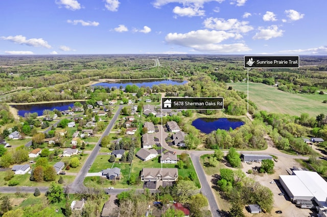 5678 Sherman Oaks Rd, Stacy, MN 55079 - aerial overview of property's location with a nearby body of water and a heavily wooded area