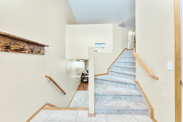 5678 Sherman Oaks Rd, Stacy, MN 55079 - staircase featuring carpet and tile patterned floors