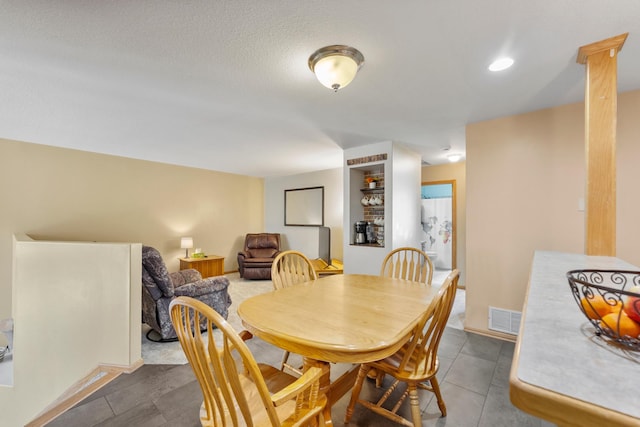 5678 Sherman Oaks Rd, Stacy, MN 55079 - dining space with dark tile patterned flooring