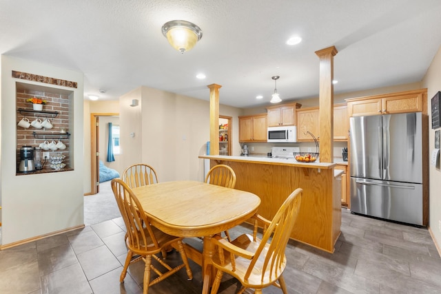 5678 Sherman Oaks Rd, Stacy, MN 55079 - dining area featuring ornate columns and recessed lighting