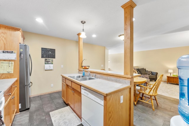 5678 Sherman Oaks Rd, Stacy, MN 55079 - kitchen with dishwasher, freestanding refrigerator, open floor plan, ornate columns, and light countertops