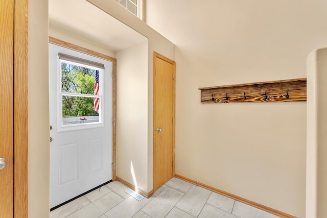 5678 Sherman Oaks Rd, Stacy, MN 55079 - doorway with light tile patterned floors and baseboards