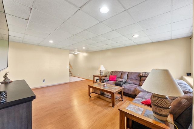 5678 Sherman Oaks Rd, Stacy, MN 55079 - living room featuring light wood-style flooring, recessed lighting, a drop ceiling, and stairway