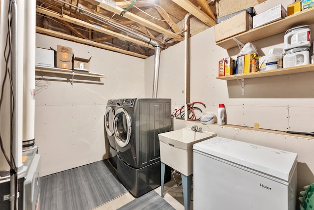 5678 Sherman Oaks Rd, Stacy, MN 55079 - laundry area featuring washing machine and dryer and dark wood-type flooring