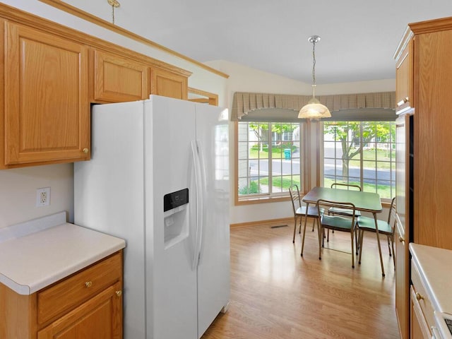 663 Regent Ln, Waconia, MN 55387 - kitchen with white fridge with ice dispenser, light wood finished floors, light countertops, pendant lighting, and baseboards