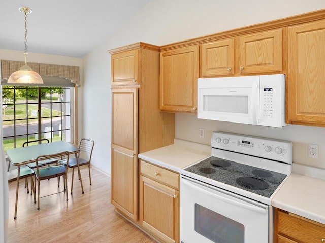 663 Regent Ln, Waconia, MN 55387 - kitchen with white appliances, lofted ceiling, light countertops, light wood-type flooring, and hanging light fixtures