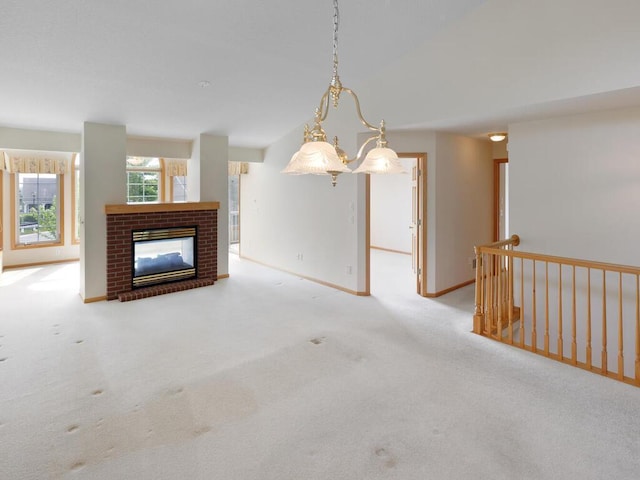 663 Regent Ln, Waconia, MN 55387 - unfurnished living room with a fireplace, carpet floors, lofted ceiling, and baseboards