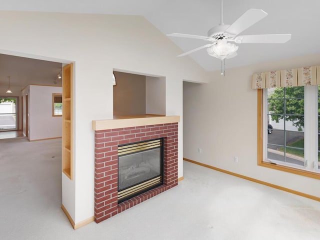 663 Regent Ln, Waconia, MN 55387 - unfurnished living room featuring lofted ceiling, carpet flooring, a fireplace, baseboards, and a ceiling fan