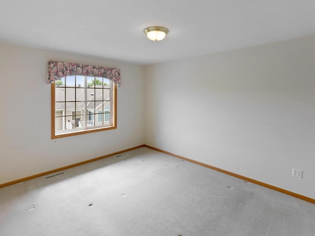 663 Regent Ln, Waconia, MN 55387 - carpeted spare room with baseboards