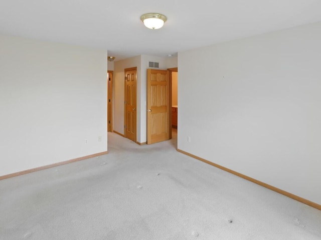 663 Regent Ln, Waconia, MN 55387 - spare room with baseboards and light colored carpet