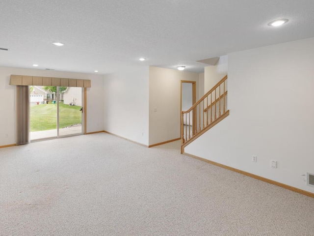 663 Regent Ln, Waconia, MN 55387 - empty room featuring baseboards, light carpet, stairs, and recessed lighting