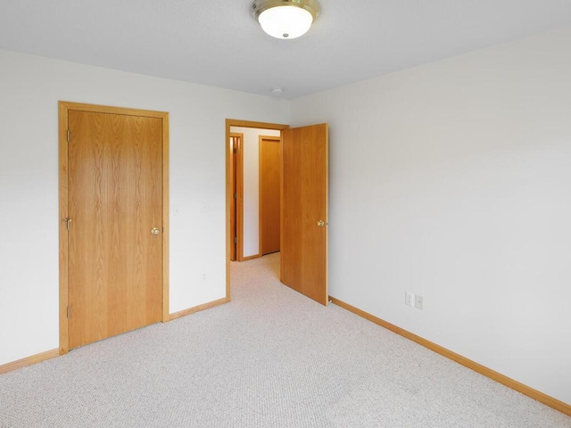 663 Regent Ln, Waconia, MN 55387 - unfurnished bedroom with carpet flooring and baseboards