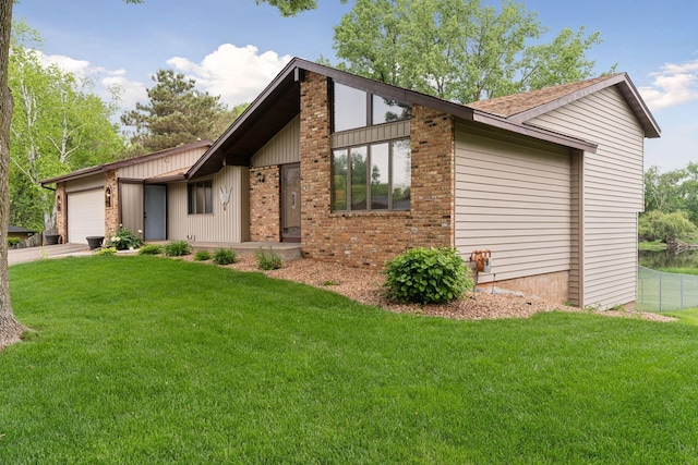 3291 Hillsboro Ave S, Saint Louis Park, MN 55426 - mid-century home featuring a garage, brick siding, and concrete driveway