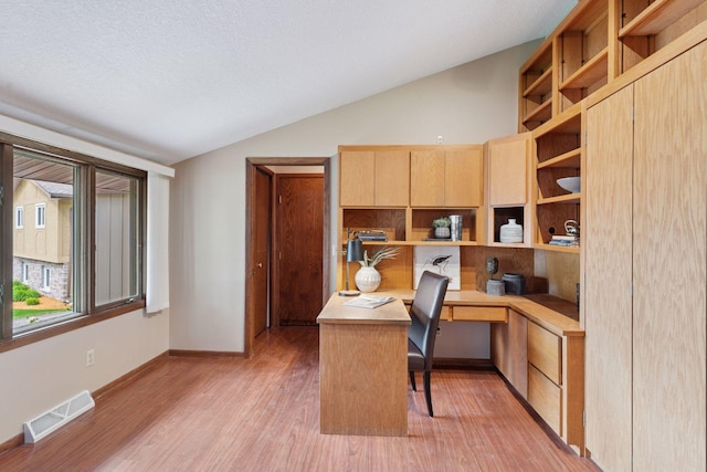 3291 Hillsboro Ave S, Saint Louis Park, MN 55426 - office area featuring built in study area, lofted ceiling, and light wood finished floors