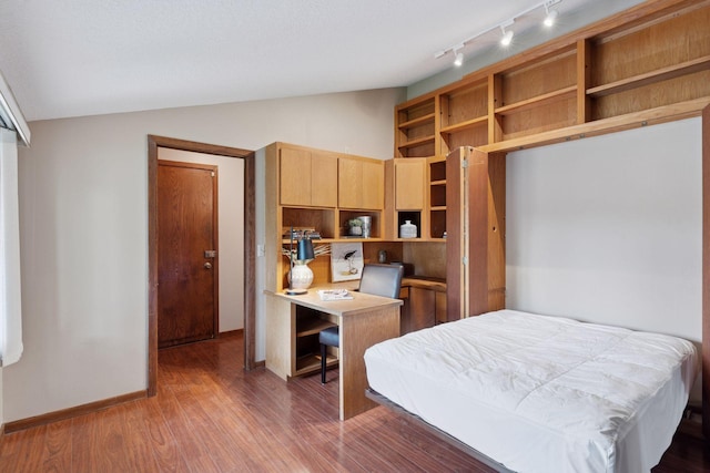 3291 Hillsboro Ave S, Saint Louis Park, MN 55426 - bedroom featuring lofted ceiling, wood finished floors, and rail lighting