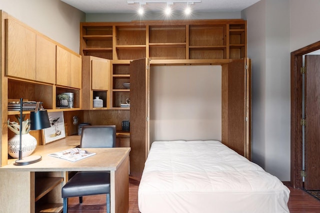 3291 Hillsboro Ave S, Saint Louis Park, MN 55426 - bedroom with wood finished floors, built in desk, and track lighting